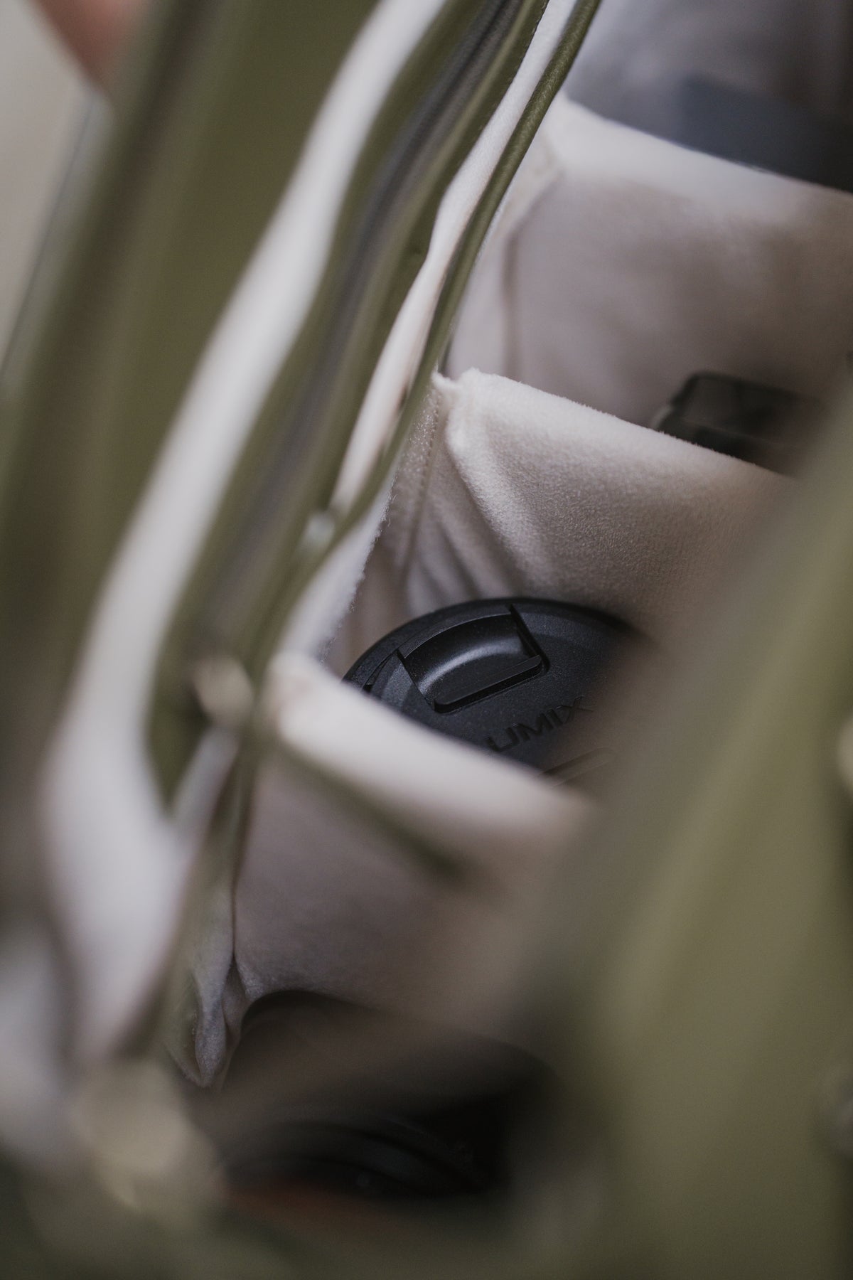 Close-up of a car seat with a cup holder in a vehicle interior.