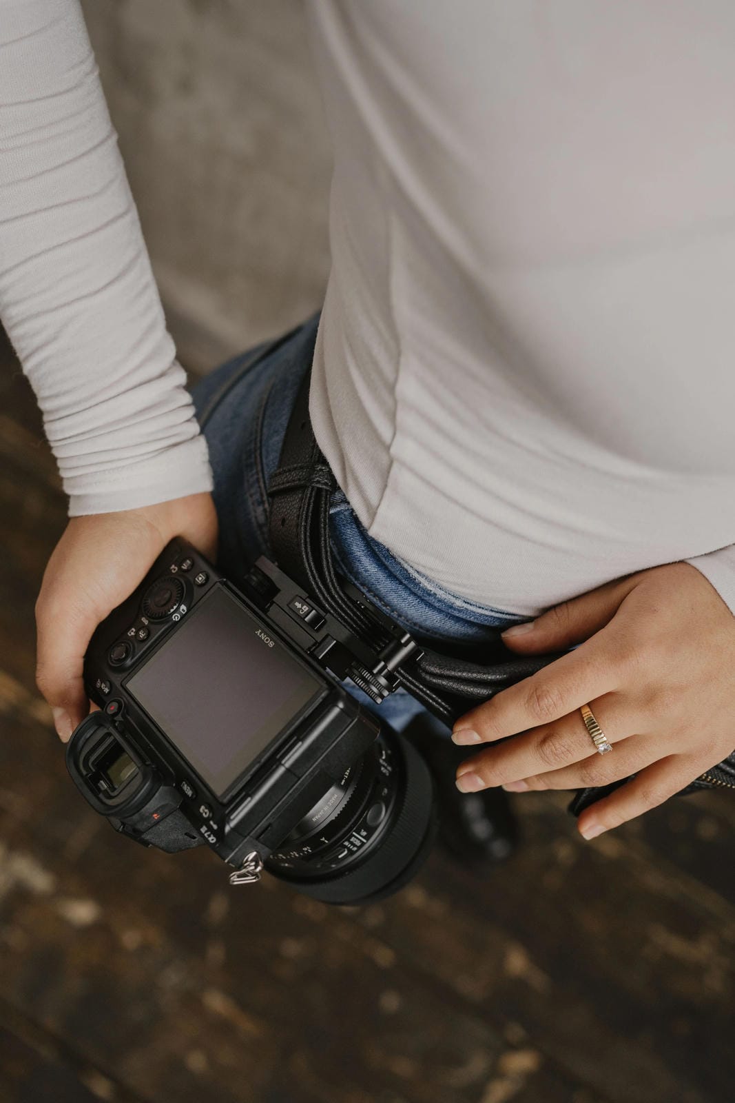 Person holding a camera with a blurred background