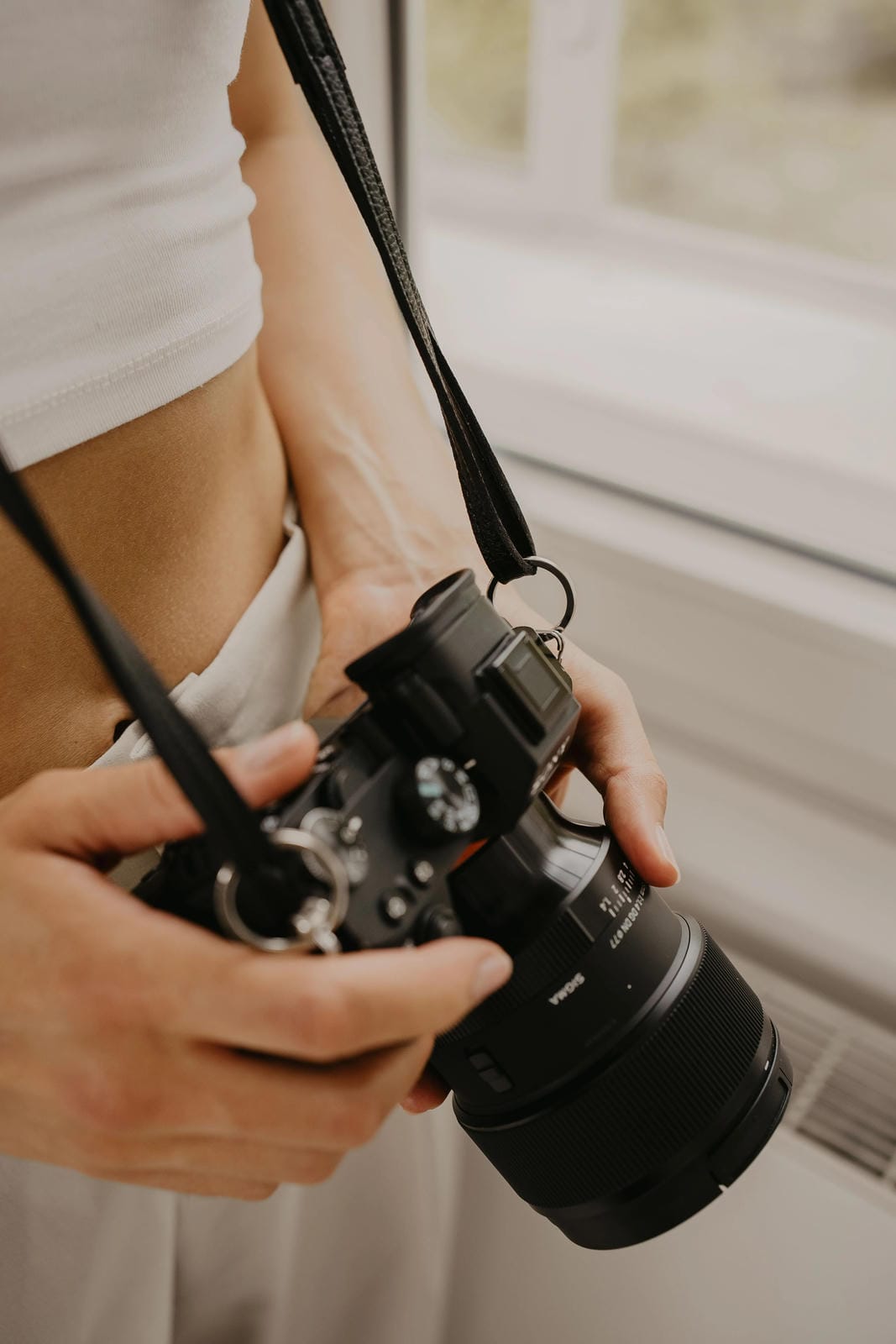 Person holding a camera with a blurred background