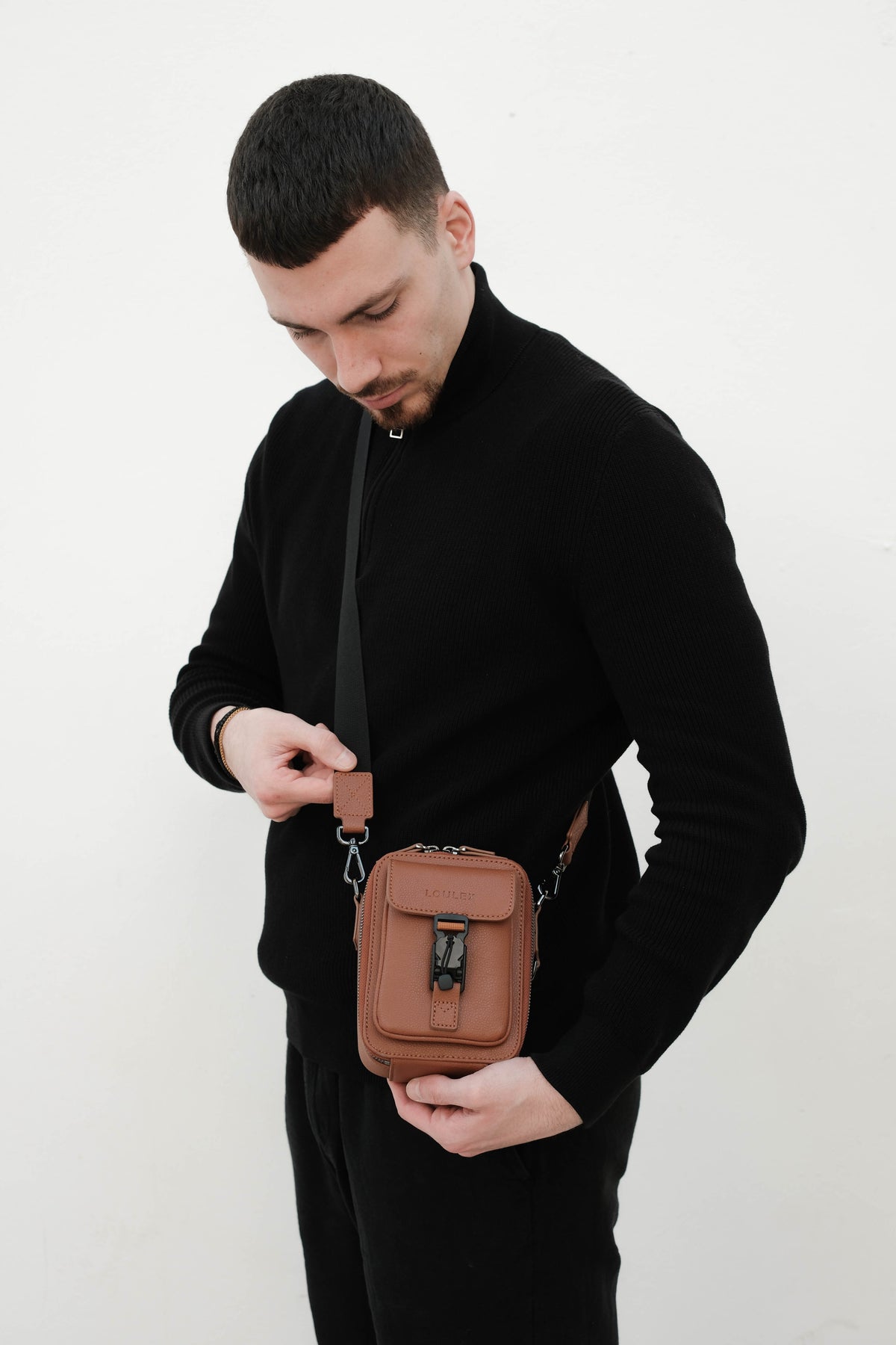 Brown leather bag with 'LOULEX' 